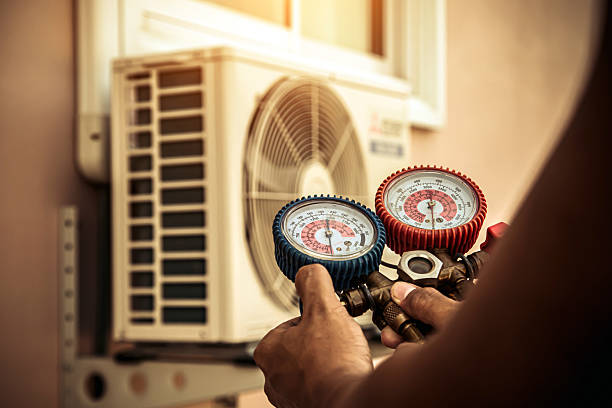 Professional Air Conditioning Service technician working in Portsmouth, RI